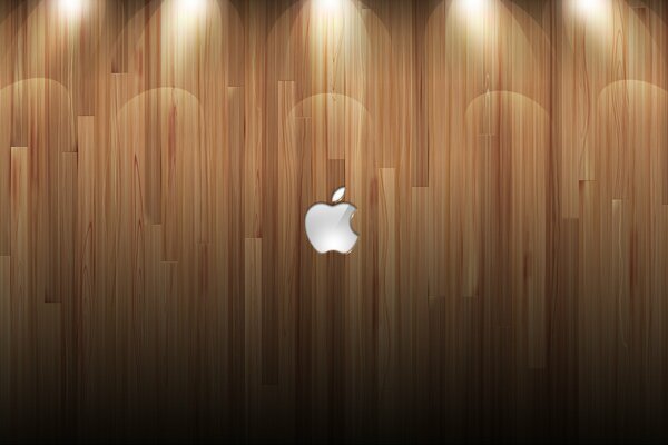 Logo aziendale Apple su sfondo in legno