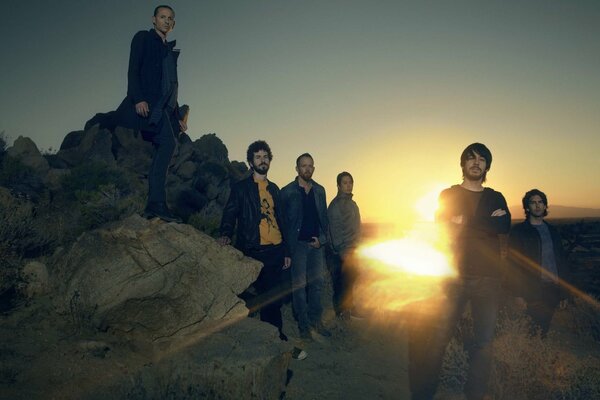 The Linkin Park group poses at sunset