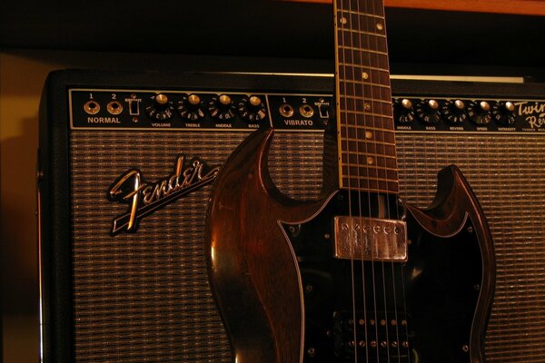 Musical instruments electric guitar on a brown background