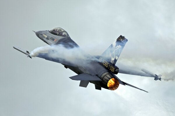 The smoke screen from the volleys of a military aircraft e