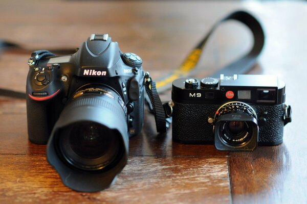 Image of nikon and leica cameras