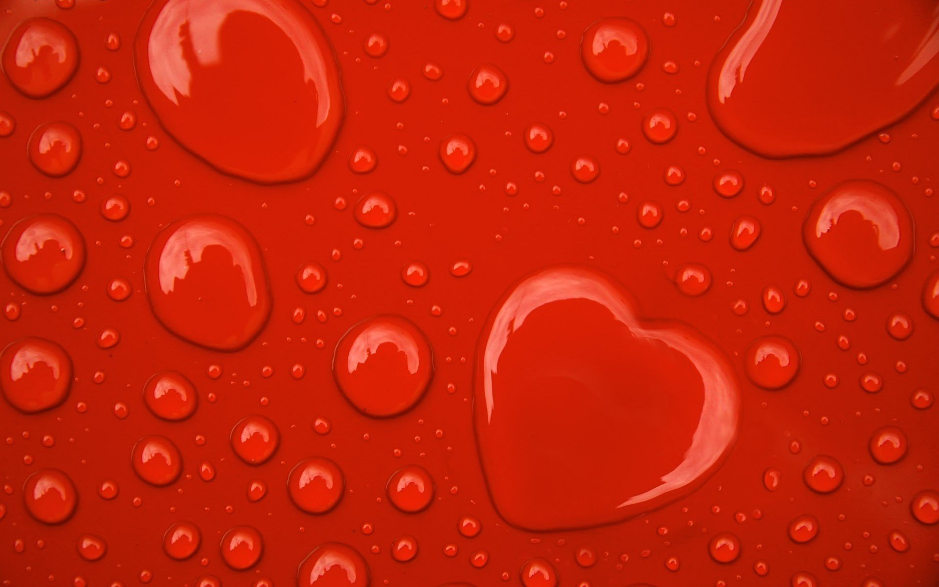 glossy surface droplets of water heart water