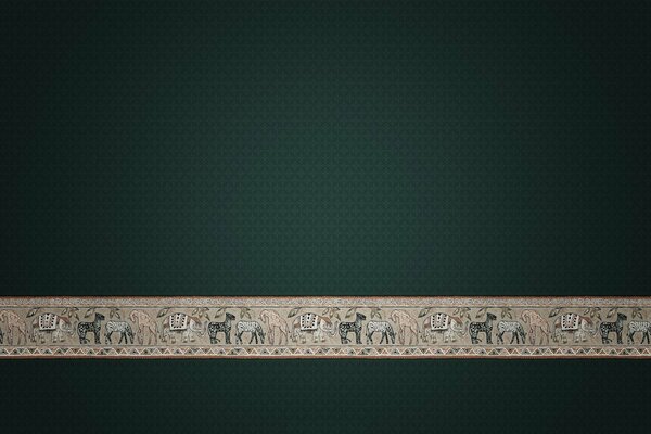 A strip of animal ornament on a dark background