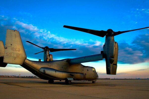 In the photo, a helicopter on the runway