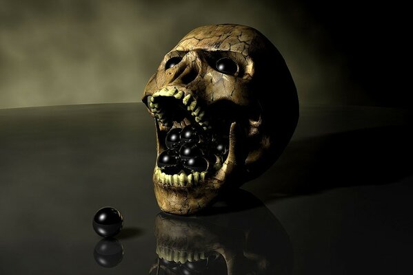 A skull with black balls on a black table