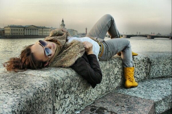 Cloudy sky and a girl with glasses