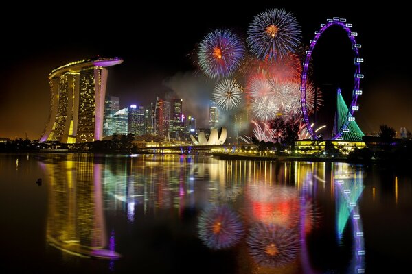 Festive fireworks on the background of the night city of Singapore