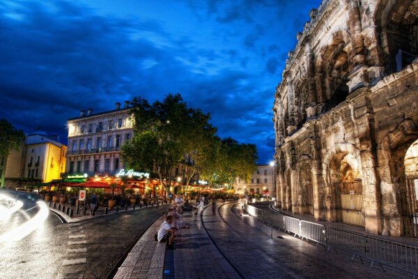 Night Colosseum in the lights of the city