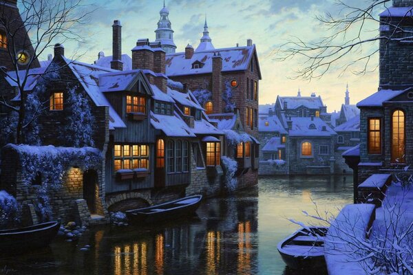 A river running through cozy houses covered with snow