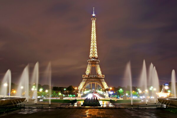 Illumination of fountains and Eiffel Tower in Paris