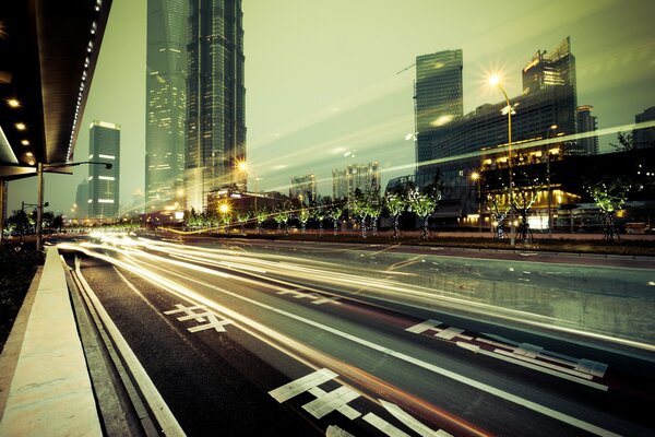 Traffic lights in the middle of megalopolis skyscrapers