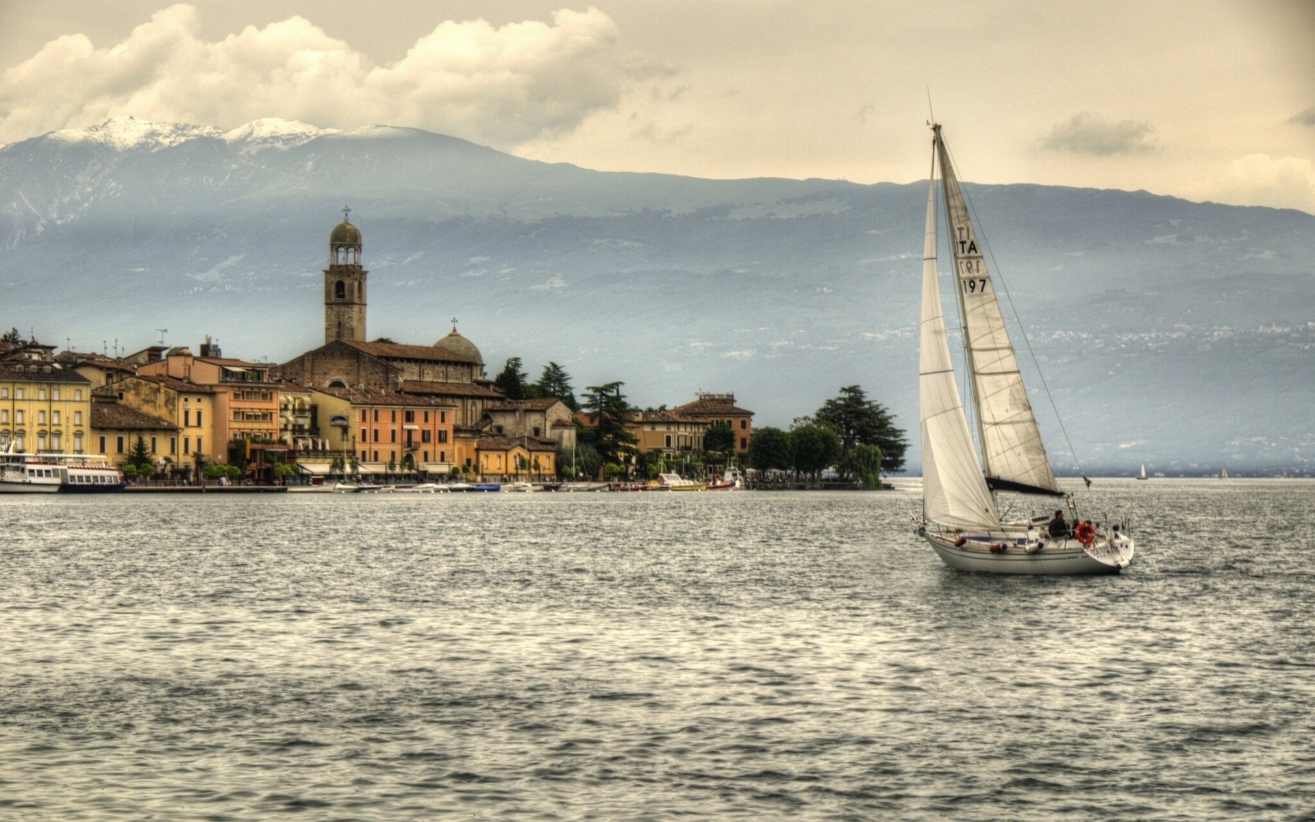 italy lombardy lake fat yacht fatty building embankment mountain lake garda