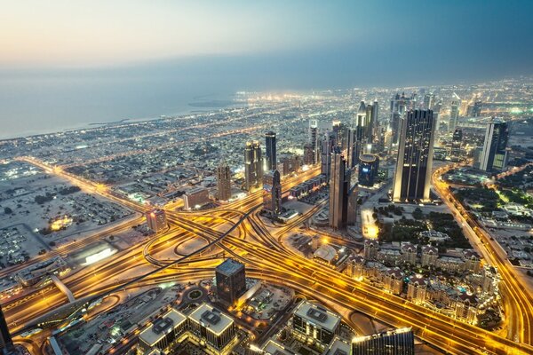 Skyscrapers in Dubai on the background of the morning ocean