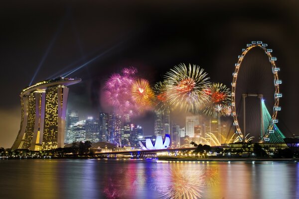 Fireworks in the sky at the Ferris wheel