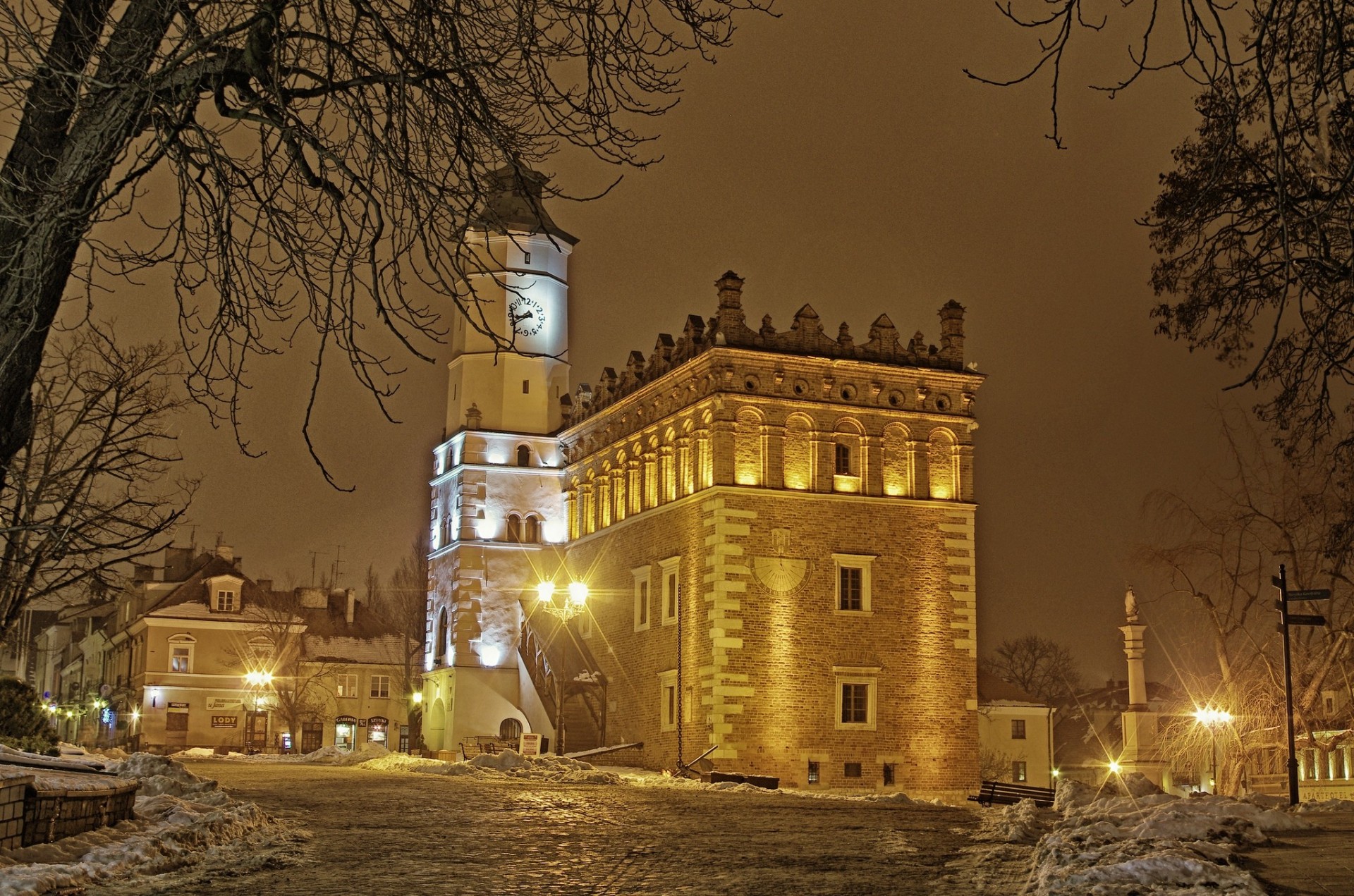 night poland town light building snow winter tree house