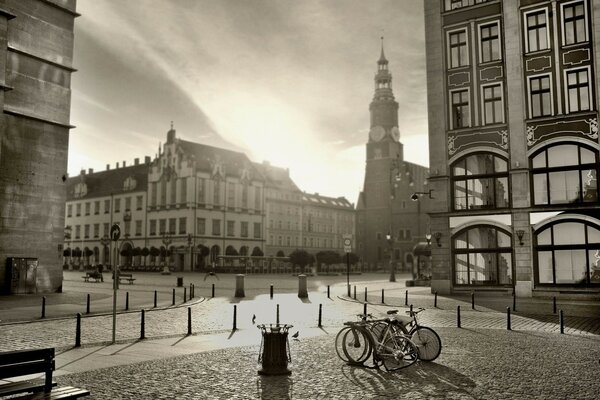 Buildings and bicycles in black and white