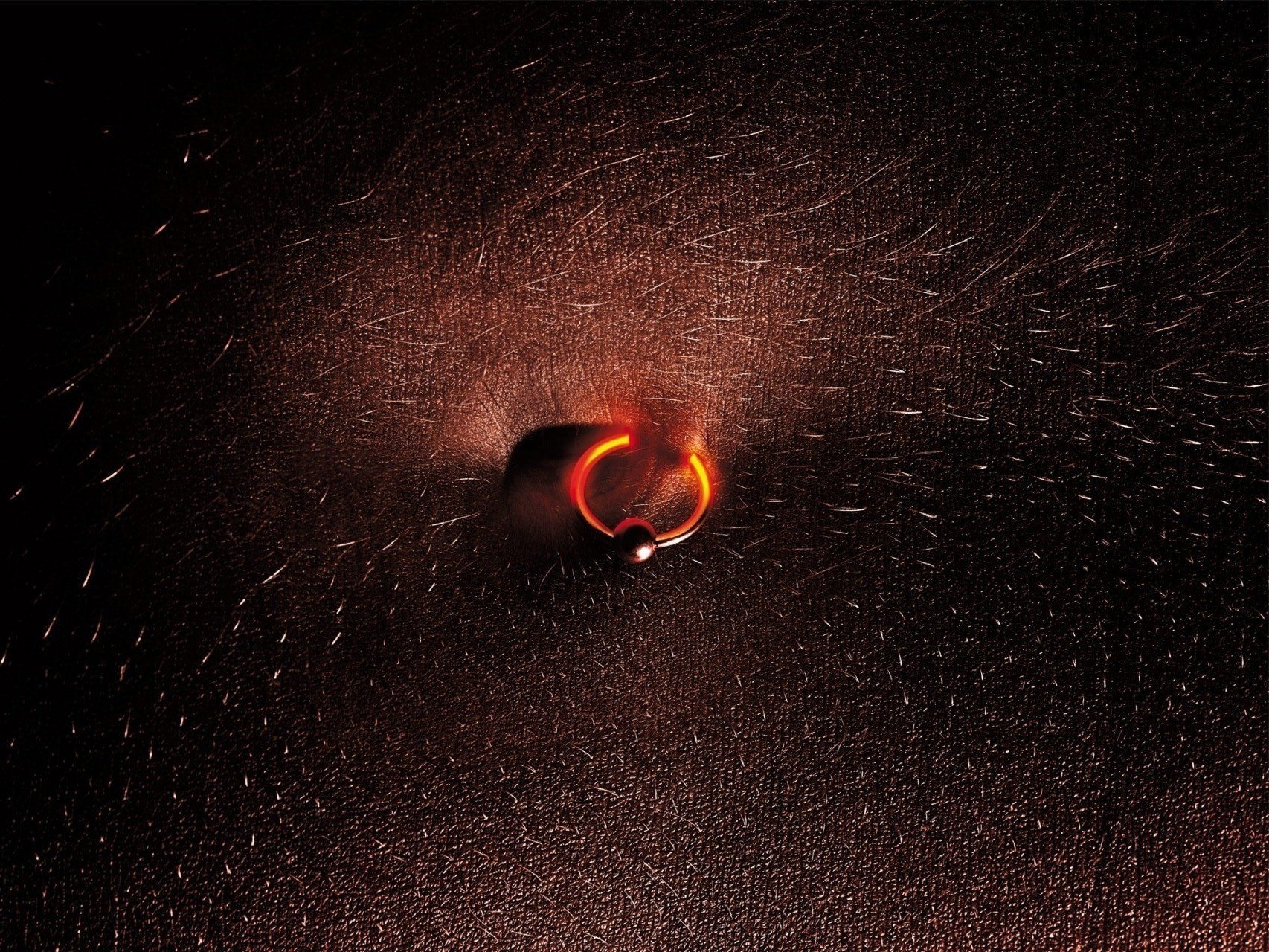 glowing earring puncture skin sparks macro hairs navel piercing