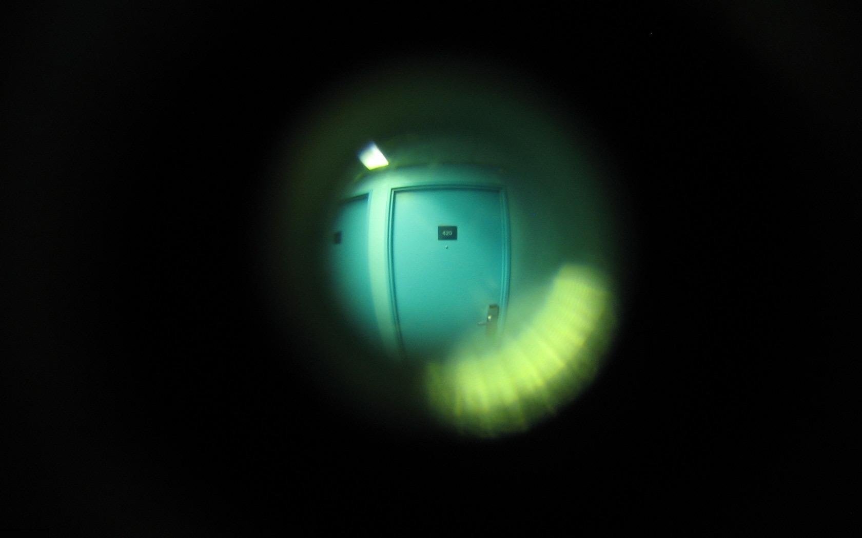 the view through the peephole next door lamp