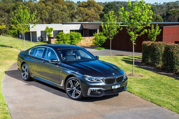 Black BMW 7 series sedan on a beautiful background