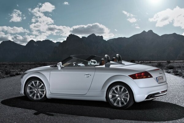 Silver audi on the background of mountains