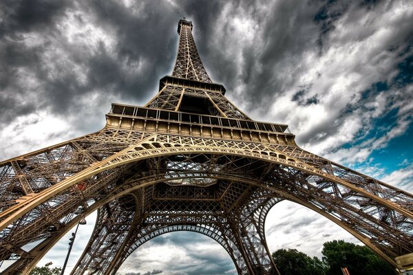 Eiffel Tower against a cloudy sky