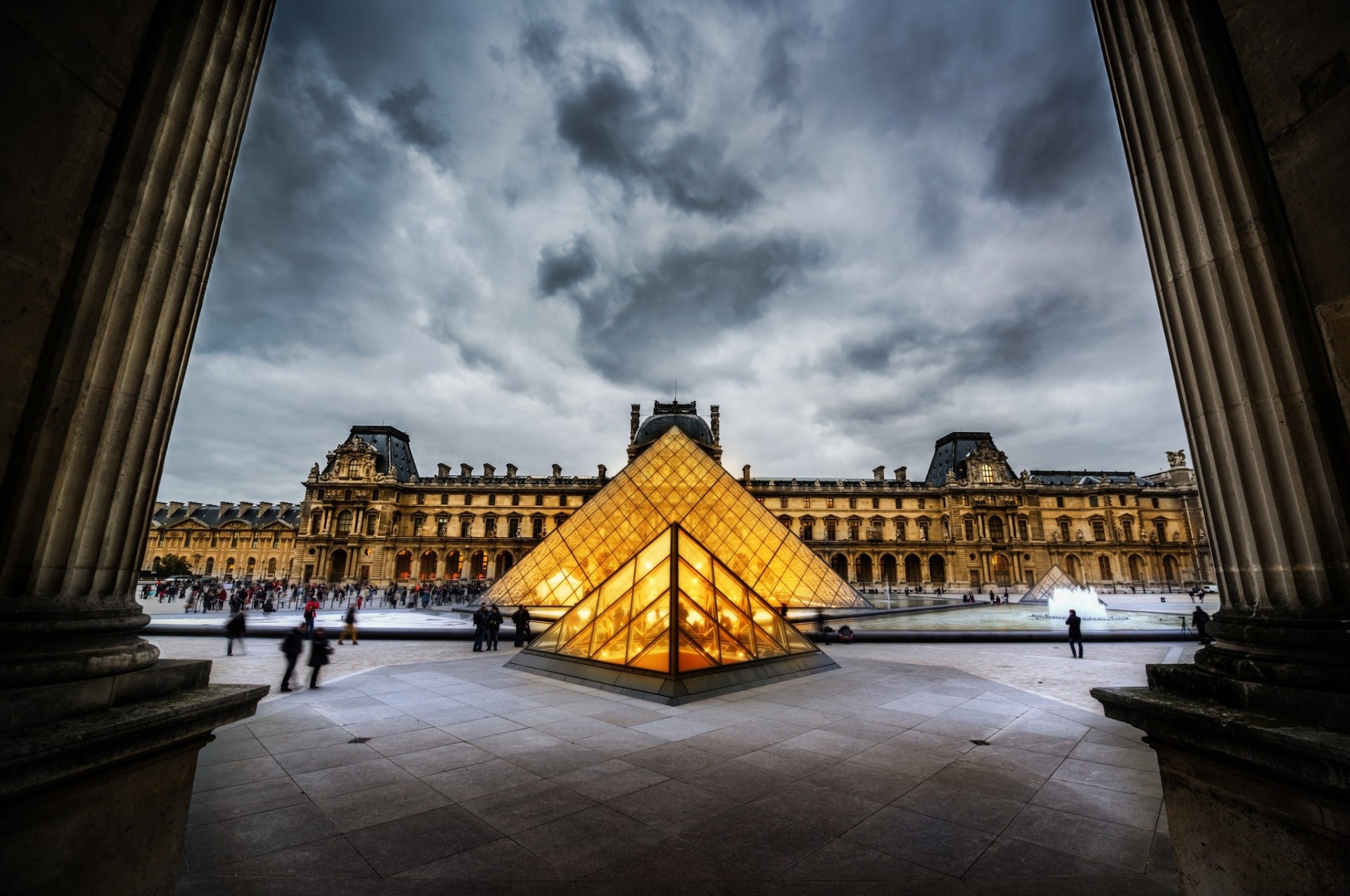 pyramid museum france the louvre paris town column sky rain people