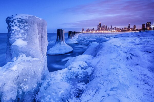 Evening city on the background of ice blocks