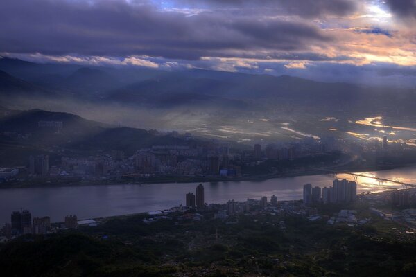 Night city in Taiwan. fog over the river