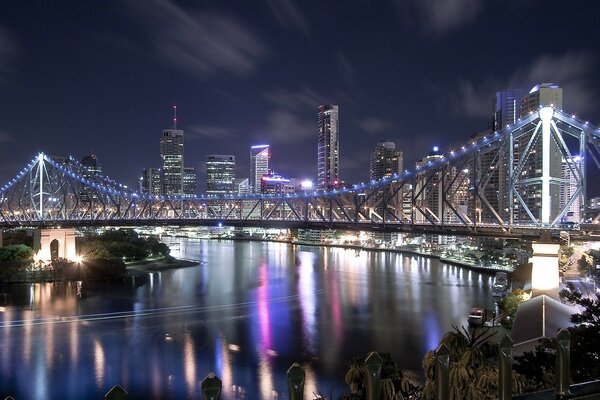 Lights of houses and a bridge in the night city