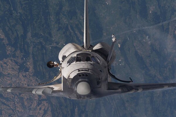 A space shuttle flying on a mission