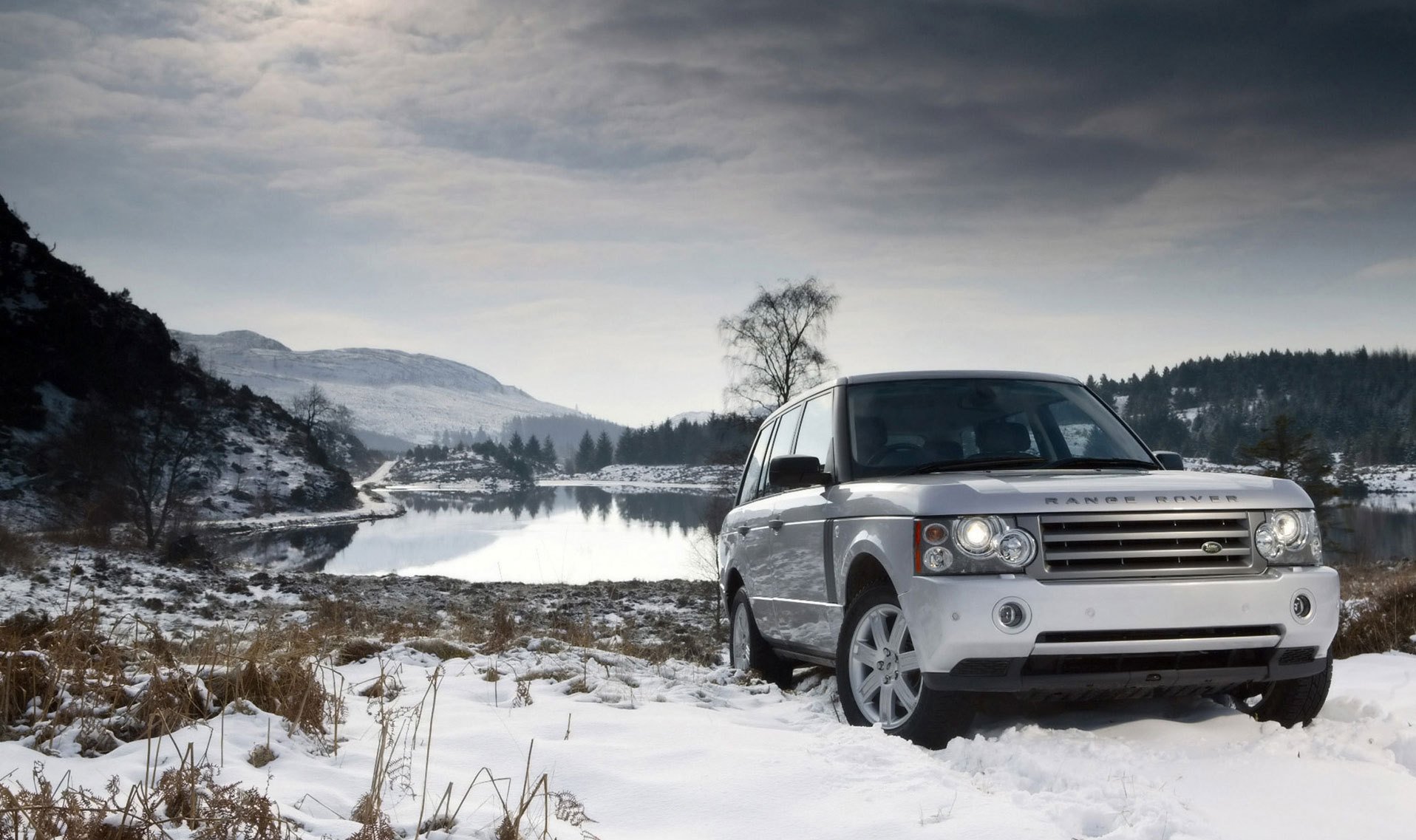 land rover panorama land rover snow lake winter landscape mountains view white car car headlights passenger cars transport auto motor transport