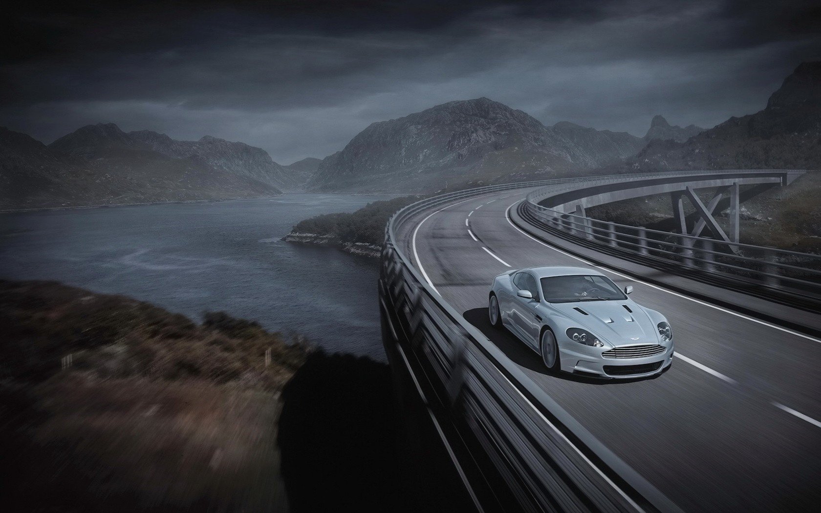 sul ponte in curva aston martin aston martin grigio fiume velocità traffico marcatura svolta auto d argento auto automobili trasporti auto veicoli a motore