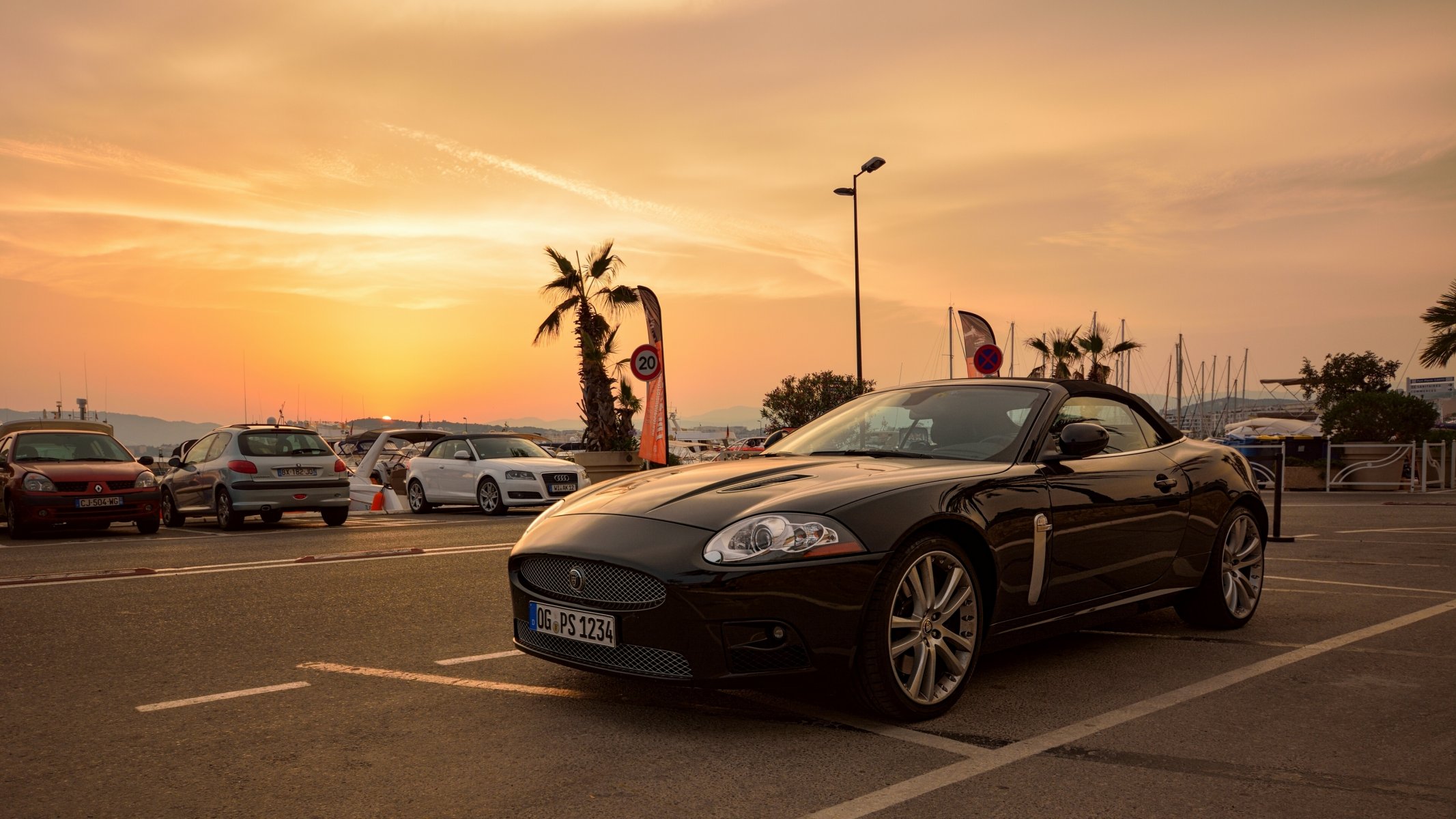 jaguar sportwagen parkplatz sonnenuntergang