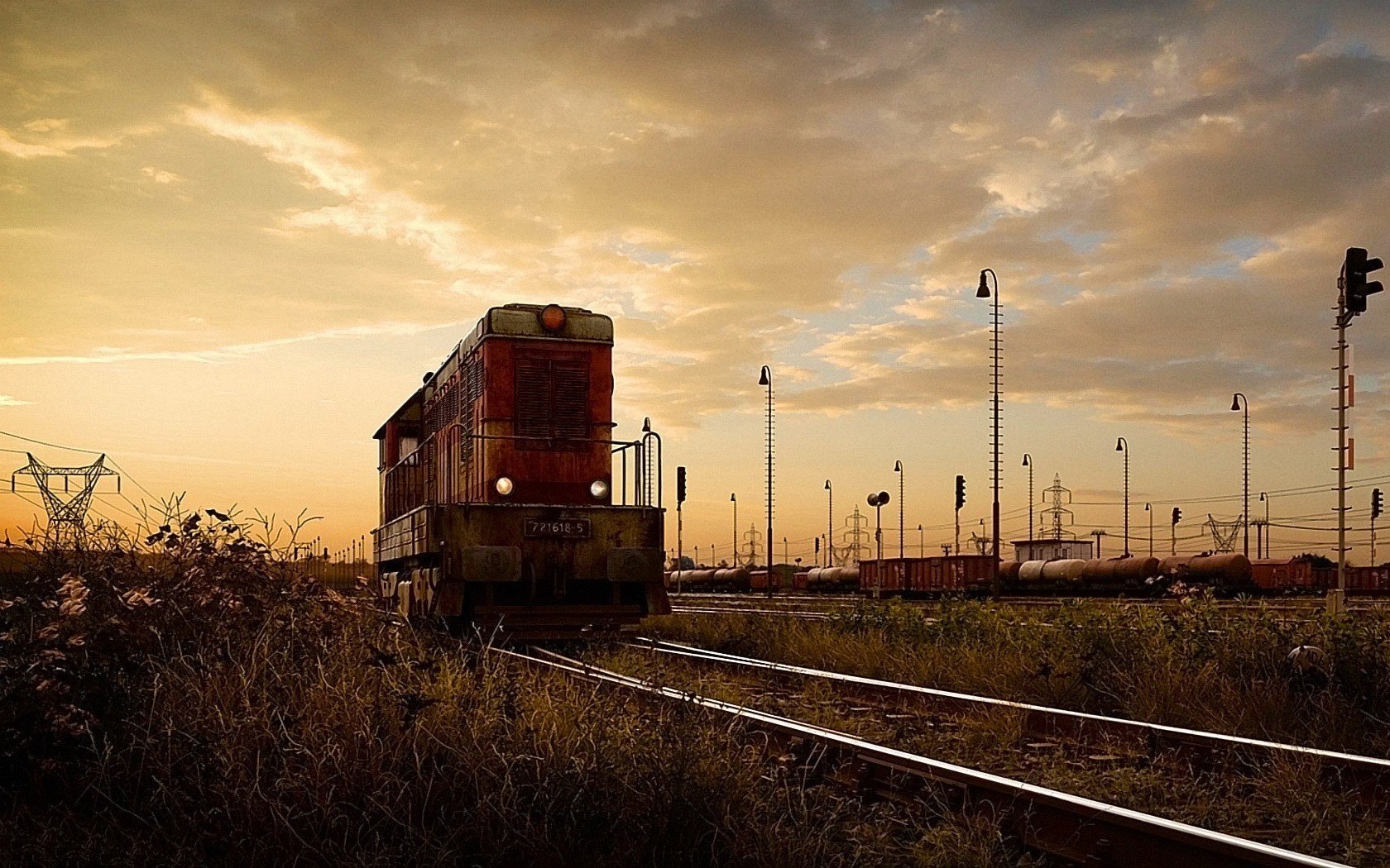 railway locomotive rails sunset train transport station sky clouds clouds grass evening railway transport