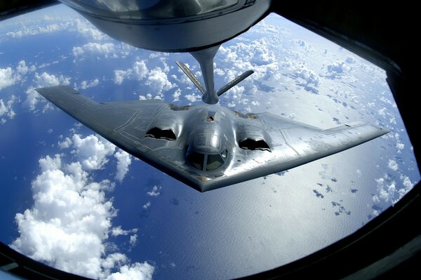 Refueling an air plane right in the sky