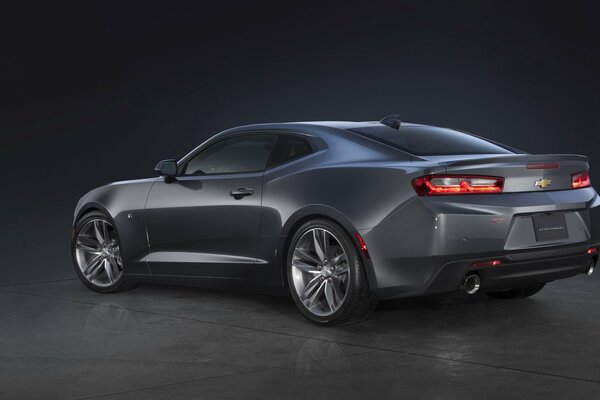 Grey chevrolet camaro pc 2015 on a dark background rear view