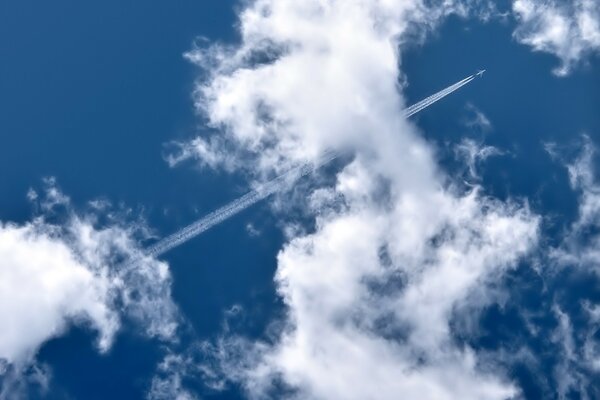 The plane disappeared into the clouds and left a trail with you