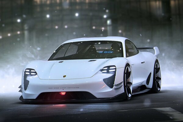 Porsche blanco en el fondo de la ciudad de la noche