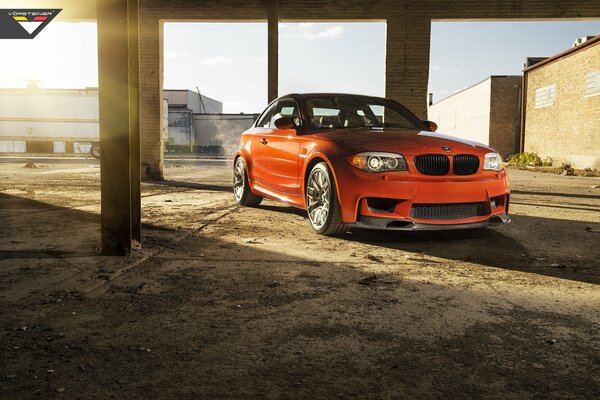 Orange bmw in urban surroundings