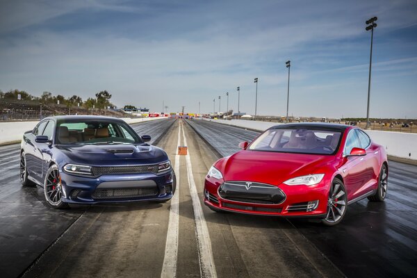 Red Tesla Model S and blue charger P85D