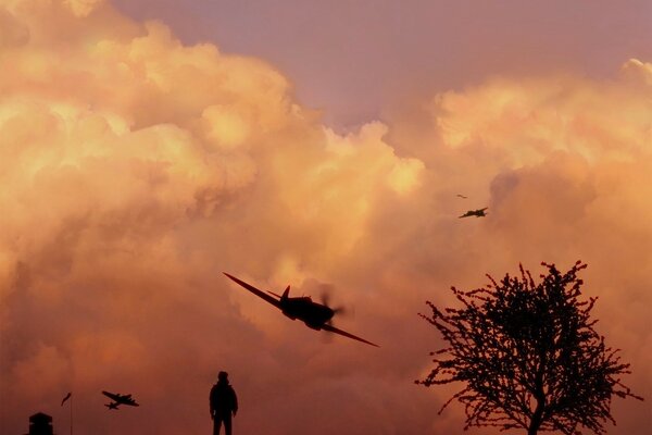 Dunkler orange-roter Himmel mit Flugzeugen