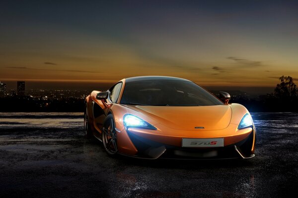 Orange mclaren coupe at sunset