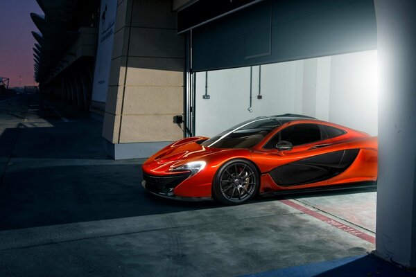 Orange supercar pulls out of the garage