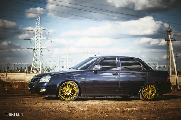 Lada Priora on the background of electric poles