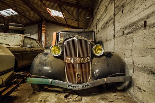 An old car in the garage for scrap