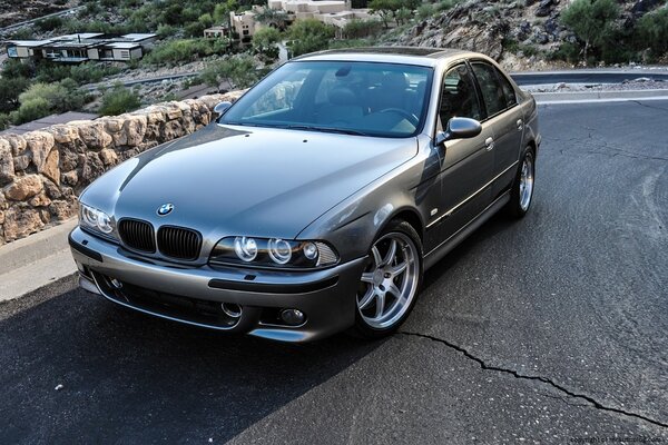 Silver bmw m5 in a rocky gorge