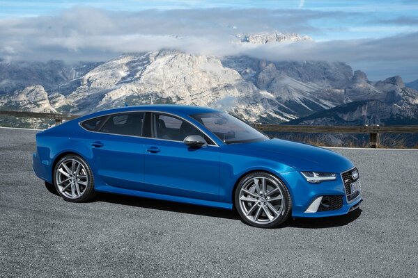 Mountains, sky, a wonderful background for a sports Audi