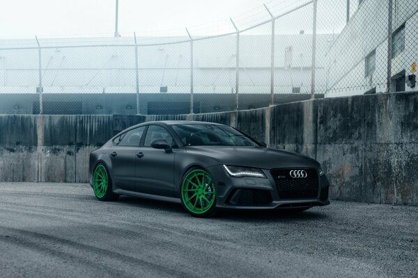 Black matte BMW with green wheels