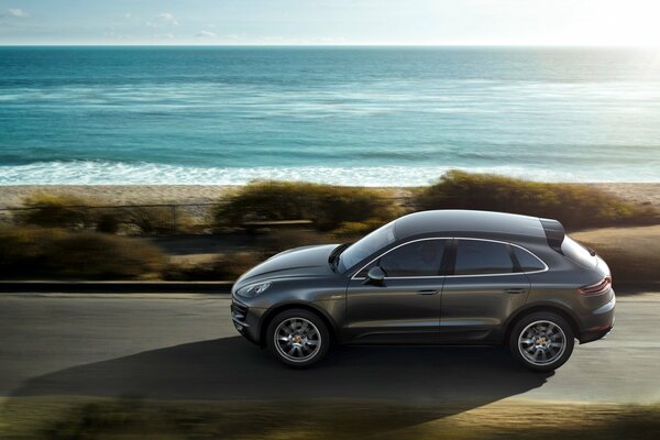 Porsche macan s SUV near the sea