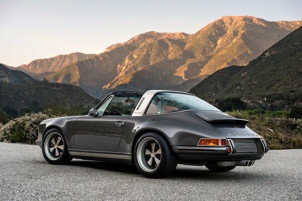 Beautiful car on the road against the background of mountains